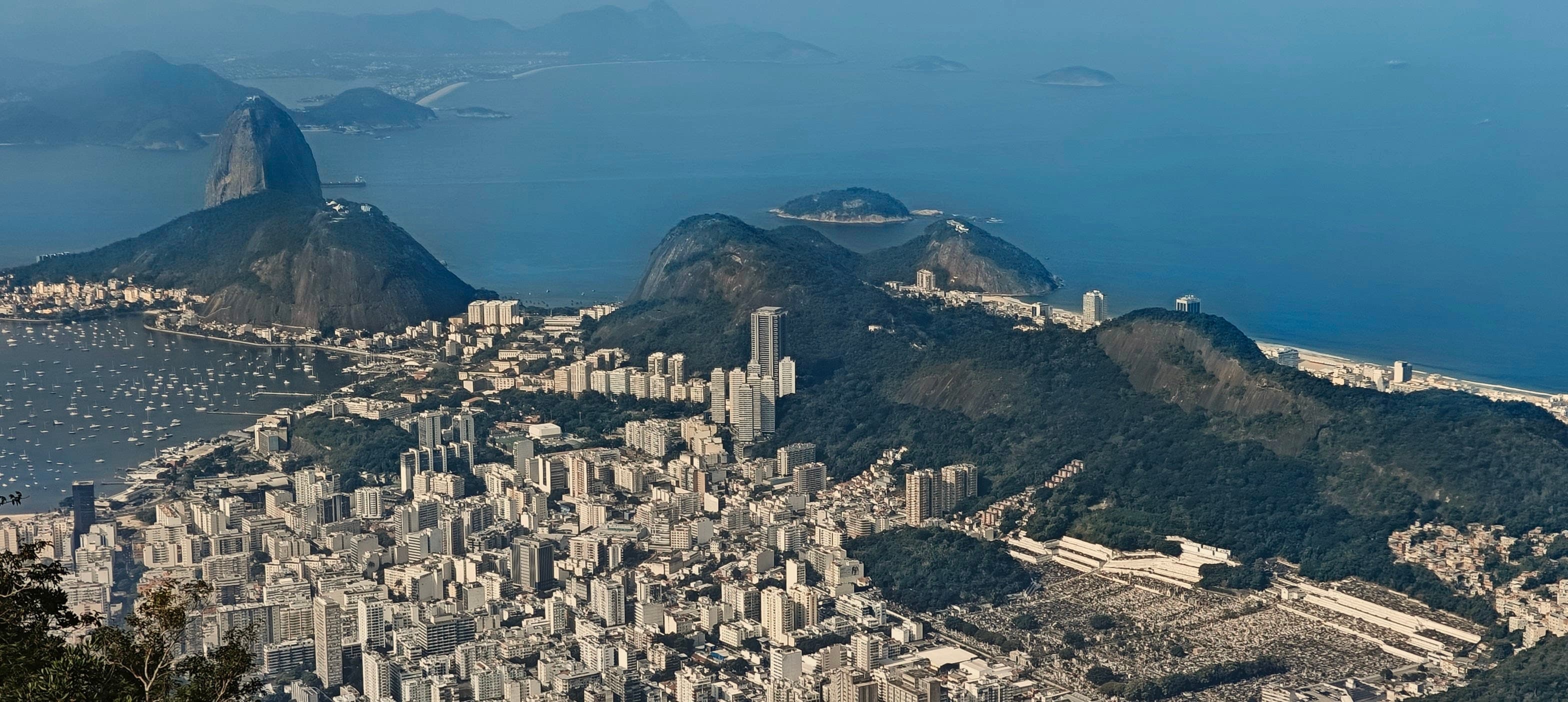 Sugarloaf Mountain and Morro da Urca above Guanabara Bay and the dense city below.