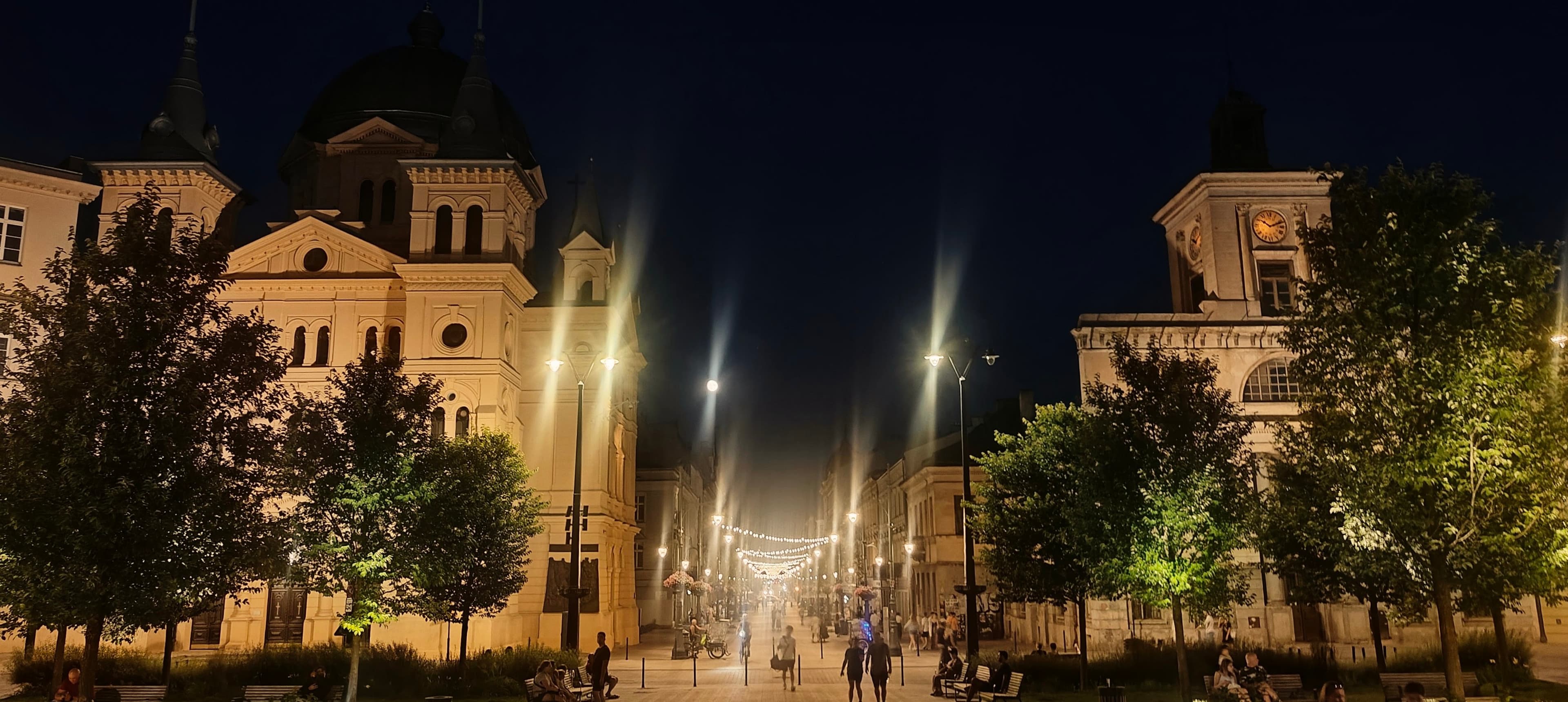 Night view from Freedom Square along Piotrkowska Street with the Church of the Holy Spirit on the left.