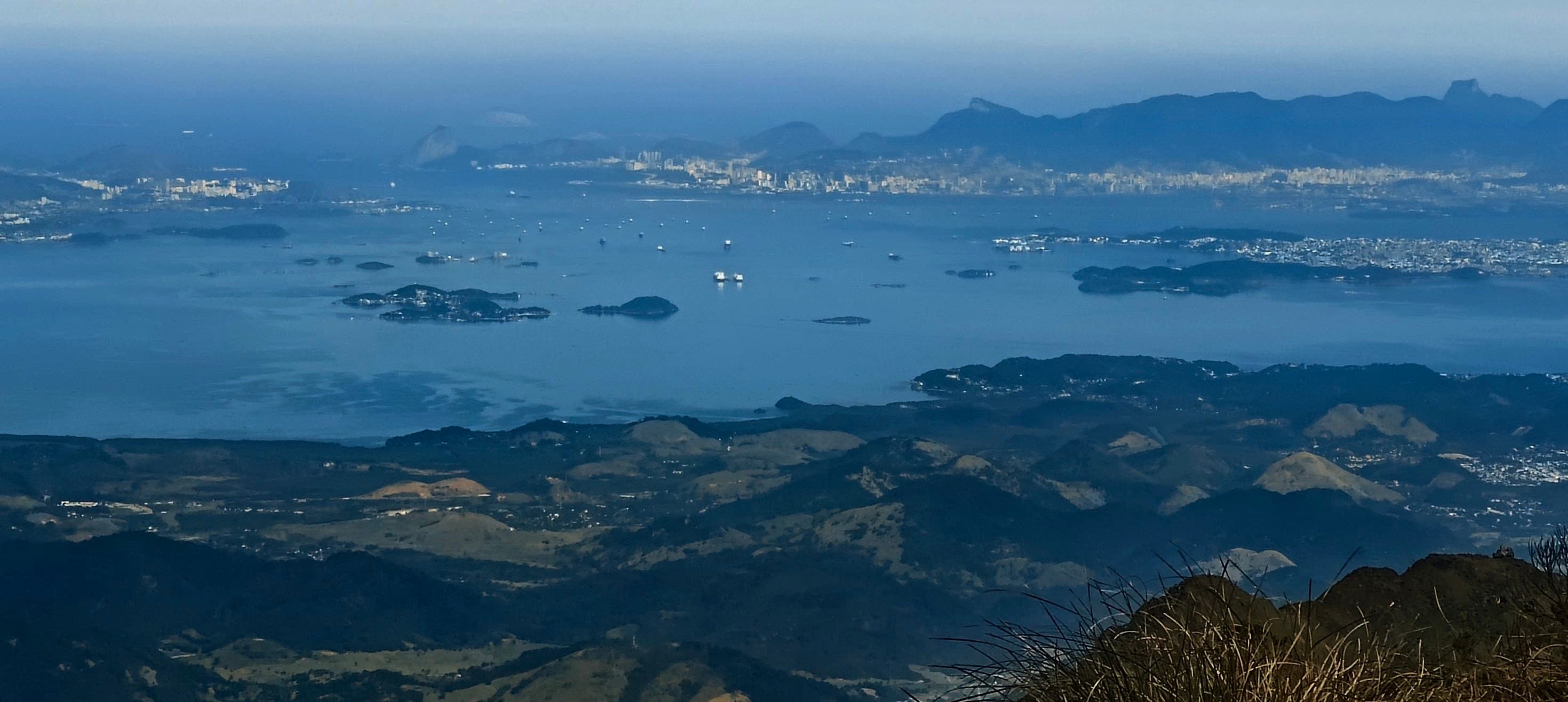 Guanabara Bay and distant urban coastline seen from the high slopes of Pedra do Sino.