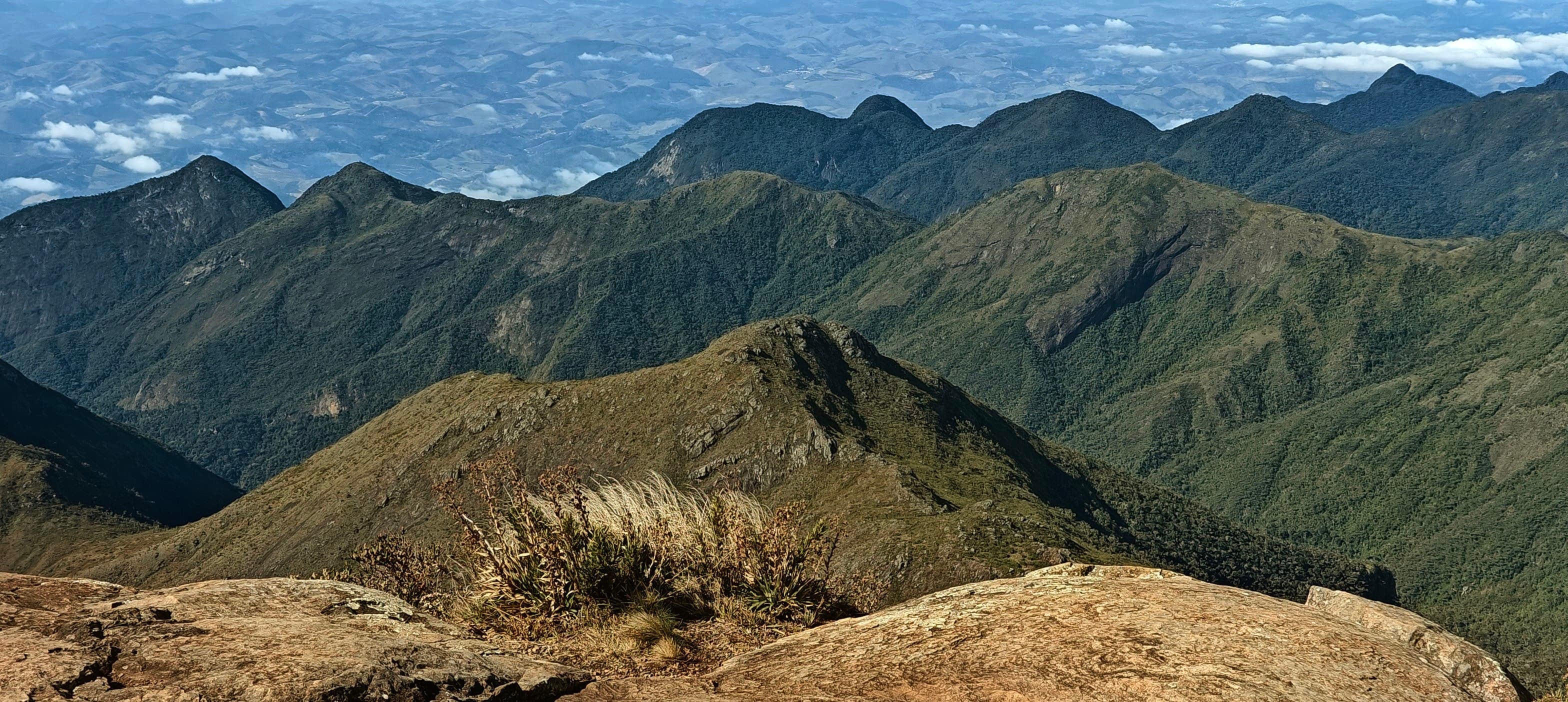 Steep green ridges and shadowed valleys in the high Caparaó massif.