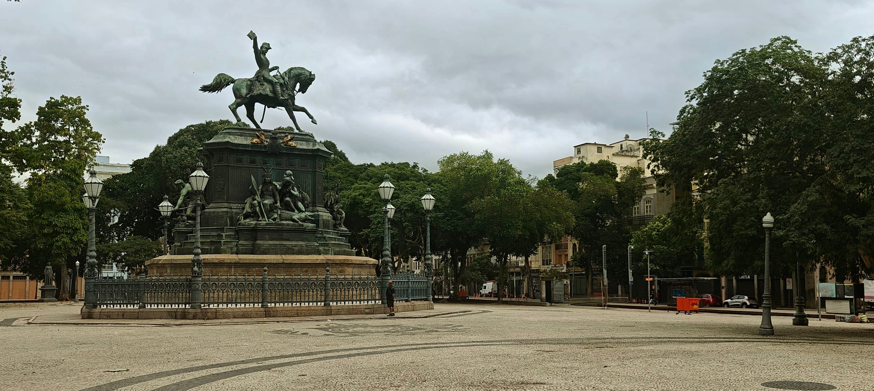 The equestrian monument to Dom Pedro I stands among trees in Praça Tiradentes.