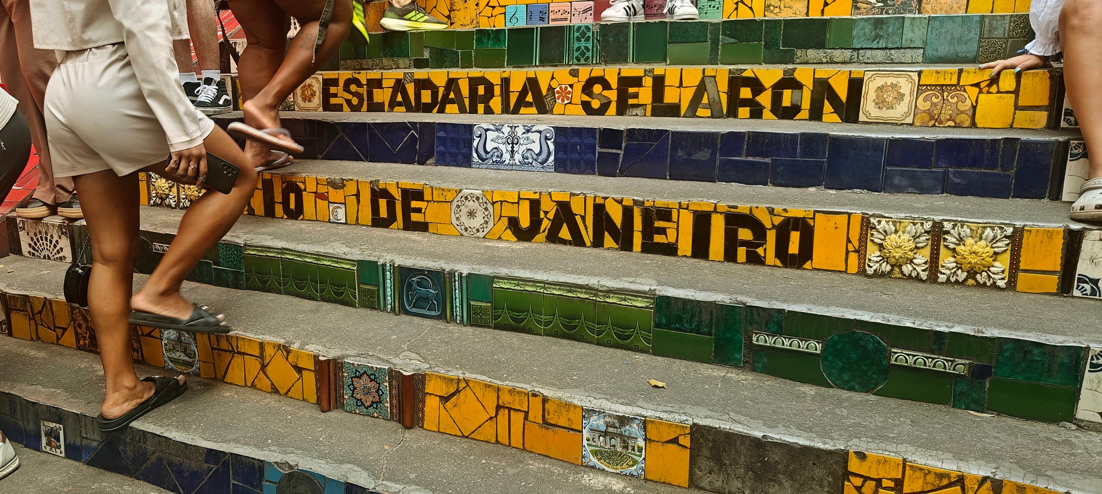 Tiled risers on Escadaria Selarón spell out the staircase name and Rio de Janeiro.