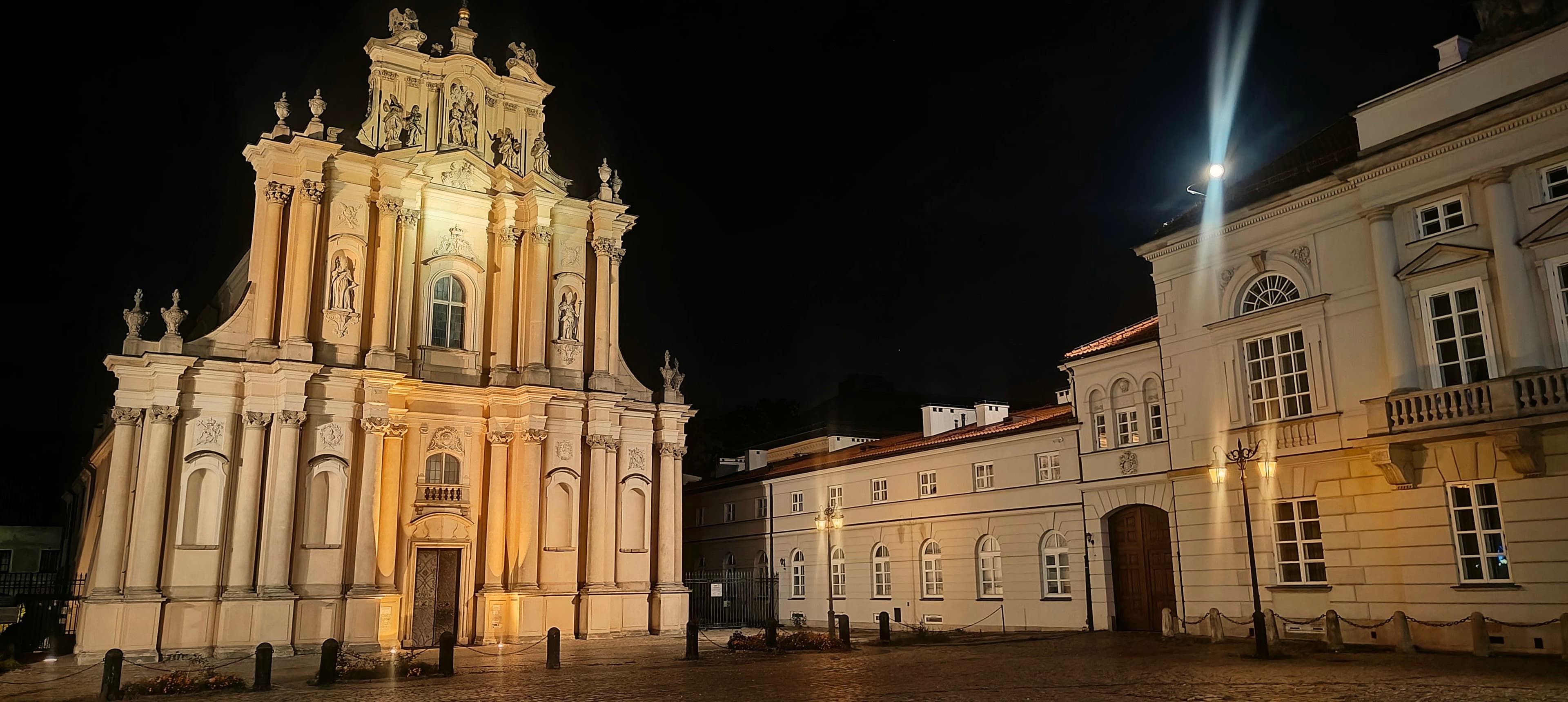 Illuminated Baroque façade of the Visitationist Church on Krakowskie Przedmieście in Warsaw.