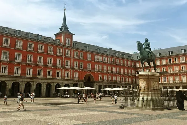 Plaza Mayor with its red façades and the equestrian statue of Philip III.